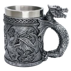 a metal mug with a dragon on it