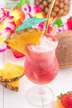 a drink in a glass with a straw garnish and pineapple on the side