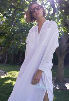 Eco friendly caftans and tunics inspired by the ocean, made on main street. Ethically sourced and locally made in Los Angeles. Inspired by French-girl chic and summers on the Cote d'Azur, meet our new favorite dress. Part shirt, part dress, part mens-wear inspired tunic, we love the oversized pockets, delicate pleats at the shoulder and generous cut. Like the majority of our dresses, this one has functional pockets, too. The cotton poplin is super soft and packs like a dream. With a shirt tail hem, pair this one with sandals or sneakers for elevated lounging or perusing your favorite market (whether its your local grocer or far away exotic bazaar). INSIDER TIP: This one is cut VERY roomy so please check the sizing tab for the best fit. Sheerness: noneFabric: 100% CottonMachine wash, hang, White V-neck Relaxed Fit Shirt Dress, White Relaxed Fit V-neck Shirt Dress, White Relaxed Fit Shirt Dress With V-neck, Summer V-neck Relaxed Fit Tunic, Spring Relaxed Fit Tunic Shirt Dress, Relaxed Fit Tunic Shirt Dress For Spring, V-neck Relaxed Fit Shirt Dress For Vacation, Relaxed Fit V-neck Shirt Dress For Vacation, Chic Oversized Shirt Dress For Summer