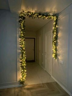 the hallway is decorated with christmas lights and garlands