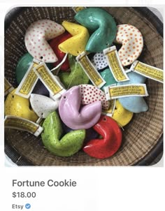 a basket filled with lots of different colored cookies