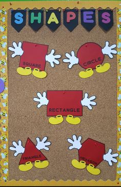 a bulletin board with different shapes and sizes on the front, including letters that spell shapes