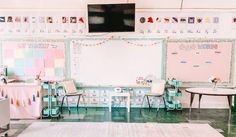 a classroom with desks, chairs and a whiteboard