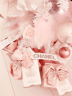 pink and white christmas decorations with chanel tags