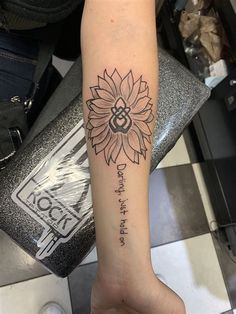 a woman's arm with a tattoo on it that says, don't touch the sunflower