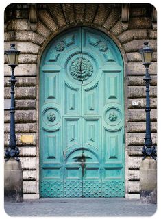 a green door with an ornate design on it