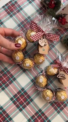 chocolates are wrapped in cellophane and tied with bows on a tablecloth