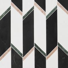 the black and white tiles are diagonally arranged in an irregular pattern with gold accents