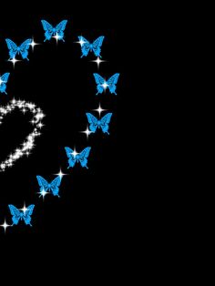 a heart made out of blue butterflies on a black background with stars in the shape of a heart