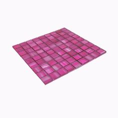 a pink glass mosaic tile on a white background