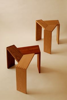 three pieces of wood sitting on top of each other