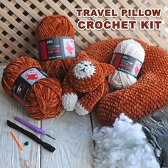 several balls of yarn and crochet hooks on a table with text overlay that says travel pillow crochet kit