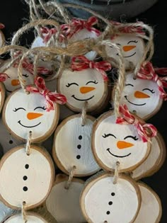 snowman ornament ornaments made from wood slices with twine and string on them