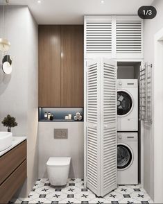 a bathroom with a washer and dryer in it