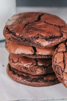 chocolate cookies are stacked on top of each other