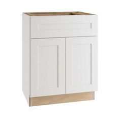 a white cabinet with two doors and one drawer on the bottom, in front of a white background