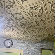 the ceiling is decorated with many different designs and shapes, including faces in squares or rectangles