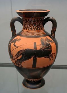 an old vase with a horse drawn design on it's side, in front of a glass window