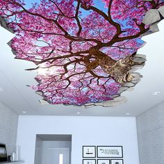 the ceiling is decorated with pink trees and pictures