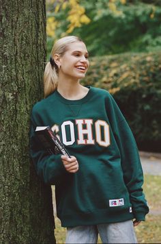 Vogue and Kith Collaborate Again—This Time With a Collegiate Collection | Vogue Black High Boots, Vogue Covers, Sporty And Rich, Russell Athletic, New Yorker, Varsity Jacket, Graphic Sweatshirt, Crew Neck Sweatshirt, Ralph Lauren