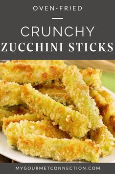 oven fried zucchini sticks with marinara sauce on a white plate and text overlay reads oven fried zucchini sticks with marinara sauce