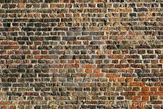 an old brick wall that has been painted red