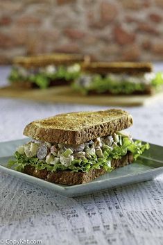 a sandwich with lettuce and other vegetables on a plate