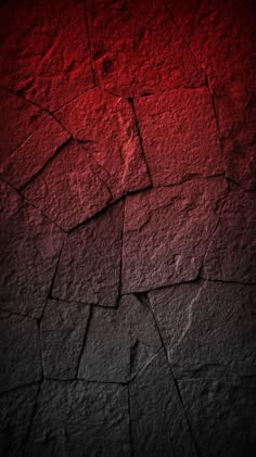 a red and black background with cracks in the concrete, which is very rough to see