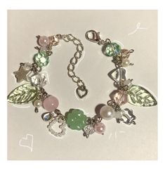 a close up of a bracelet with charms