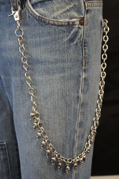 a pair of jeans with chains attached to them