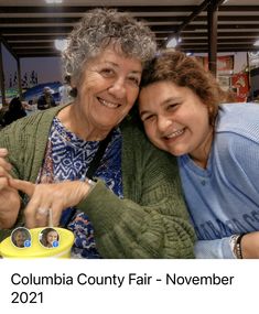 two women are posing for a photo at the columbia county fair - november 22, 2012