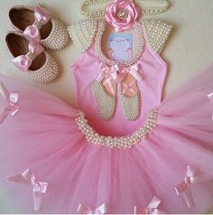 a pink tutule and matching shoes for a baby girl