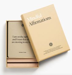 an open box containing a book about mindful affirmationss on the inside