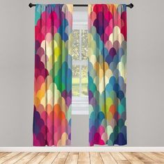 a window curtain with colorful circles on it