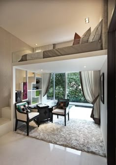 a bedroom with a loft bed, chair and desk in front of a large window