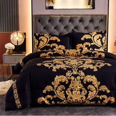 a black and gold comforter set in a bedroom