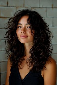 The Best Butterfly Haircut Ideas for Girls Curly Haircut Women Medium, Curly Wavy Medium Length Hair, Loose Curl Haircut, Long Bangs With Curly Hair, Cool Wavy Haircuts, Curly Hair Choppy Layers, Naturally Curly Hair Curtain Bangs, Choppy Layers For Curly Hair, Wavy Shag Haircut No Bangs