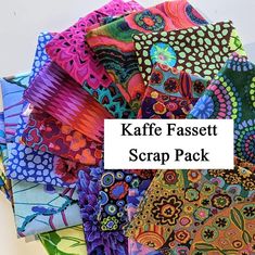 a bunch of different colored paper with the words kaffe fassett scrap pack