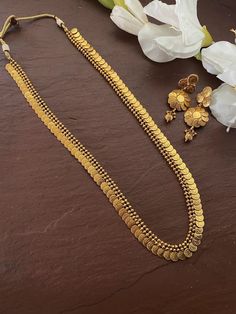 South Indian Bridal Traditional One Gram Jewelry Necklace Set with Earrings. Temple choker set. Gorgeous 24 K gold plated. This Necklace set comes in a beautiful gift box, making it an ideal gift for birthdays, weddings or anniversaries. Occasion: Perfect choice for any Indian occasion. Care: It is advisable that you keep products away from direct heat, humidity, and moisture. It is best to preserve your jewelry in the bag/box provided with the package. 100% Satisfaction Guarantee, Highest quali Coin Mala Gold, Coin Chain Gold Indian, Long Necklace Gold Indian Jewelry Sets, Mala Set In Gold, Golden Jewelry Indian, Coin Necklace Gold Indian, South Indian Jewellery Traditional, Long Gold Necklace Indian, Long Necklace Gold Indian