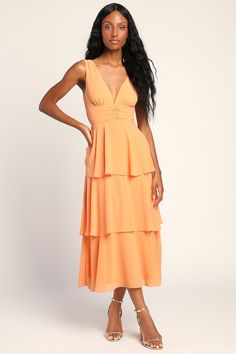 Any event will feel like a celebration when you're in the Lulus Celebration Time Light Orange Sleeveless Tiered Midi Dress! Woven chiffon shapes this chic dress that has wide straps, a V-neckline (and back), and a fitted bodice. A gathered waist tops an A-line midi skirt that's accented with flouncy tiers. Hidden side zipper/clasp. Fit: This garment fits true to size. Length: Mid-calf length. Size medium measures 50" from shoulder to hem. Bust: Great for any cup size. Waist: Fitted - very fitted Light Orange Bridesmaid Dresses, Apricot Dress, Orange Bridesmaid, Orange Bridesmaid Dresses, Orange Midi Dress, Spring Wedding Dress, Navy Blue Midi Dress, Purple Midi Dress, Guest Attire