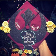 a graduation cap with flowers on it