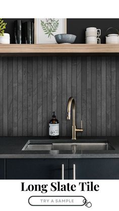 a kitchen sink with the words long slate tile on it and a black counter top