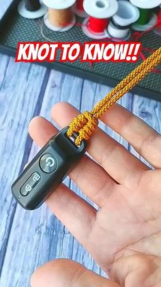 a hand holding a cord that is attached to a remote control with the words knot to know on it