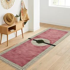 a room with a rug and hat on the floor