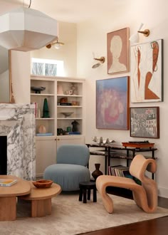 a living room filled with furniture and a fire place