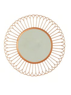 a round metal mirror on a white background