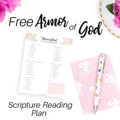 a pink flower with the words free armor of god on it next to a pen and notebook