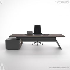 an office desk with a laptop on it