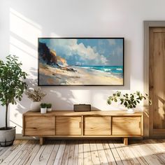 a painting hanging on the wall next to a wooden cabinet with potted plants in it