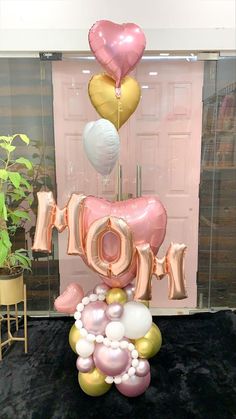 balloons are arranged in the shape of an i love you sign